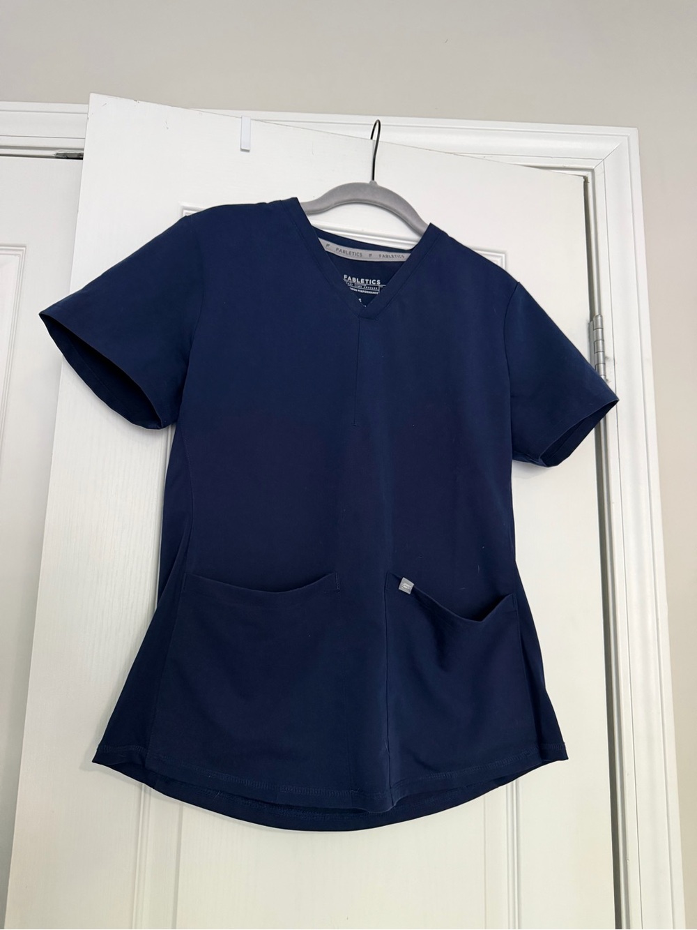 Fabletics Navy blue scrub top with 2 pockets size Small